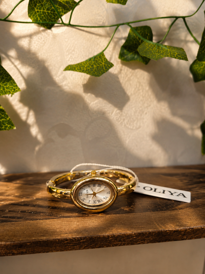 OLIYA Women's Gold Oval Bangle Watch – White Roman Numeral Dial